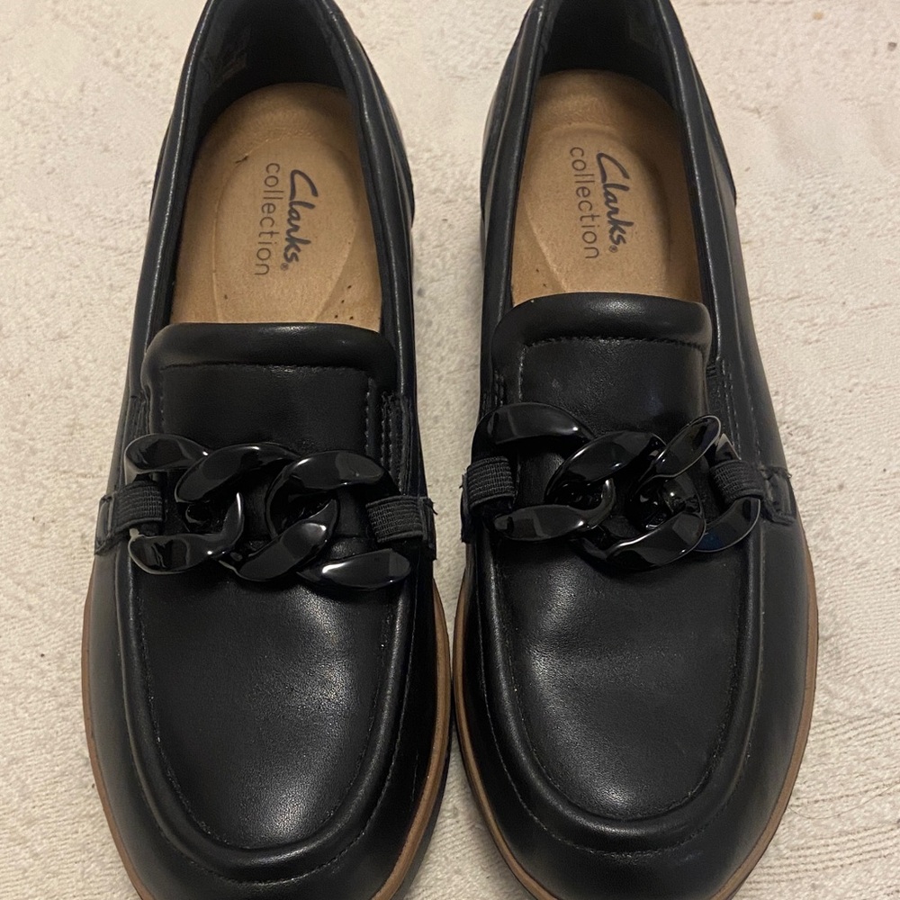 Clarks Black Leather Loafers with Glossy Chain Accent
